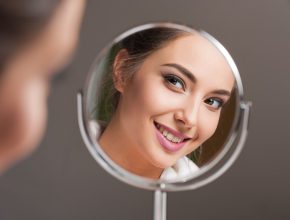 Woman smiling in mirror