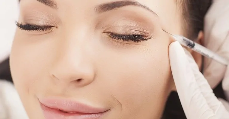 a woman during botox injection